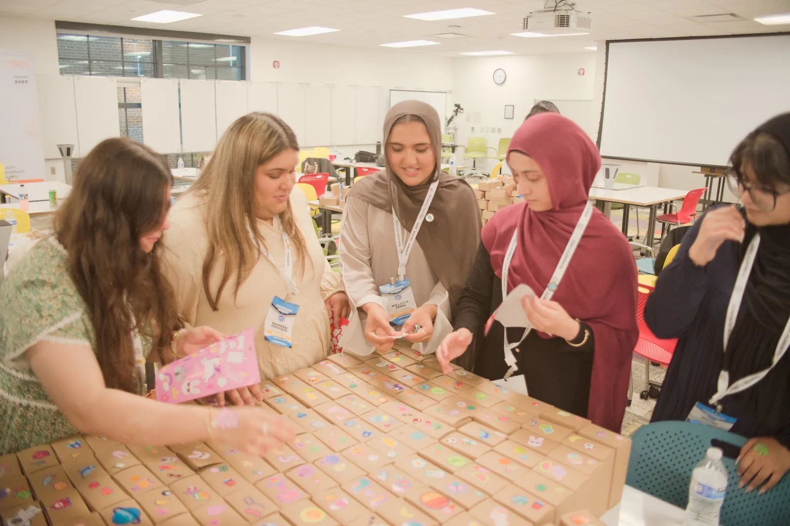 Students decorate and pack Kits of Hope together at the Leadership Summit 2026 at Michigan State University