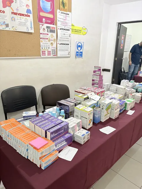 A long table of neatly arranged medication boxes stands ready for distribution in the clinic pharmacy at the Gift of Health mission in Mexico.