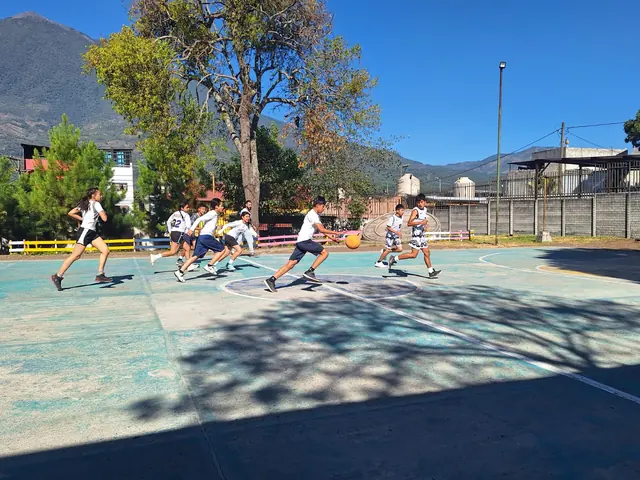 Masroor School students play basketball on the school court