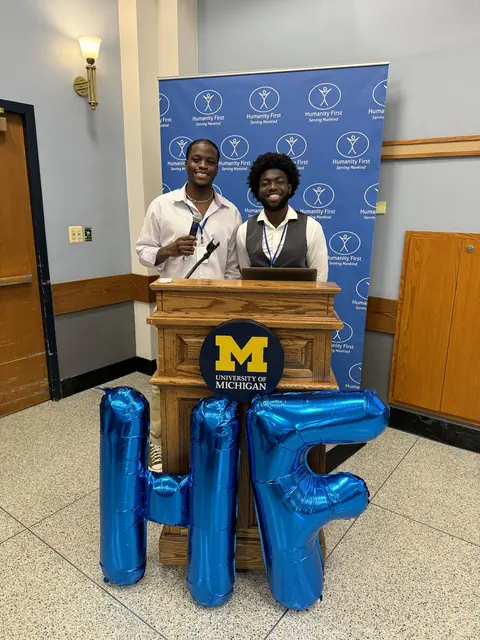 Two delegates speak at the University of Michigan podium