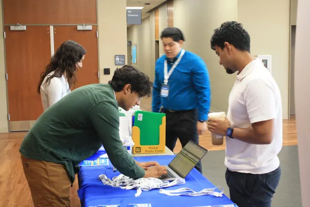 Delegates check in at the registration table