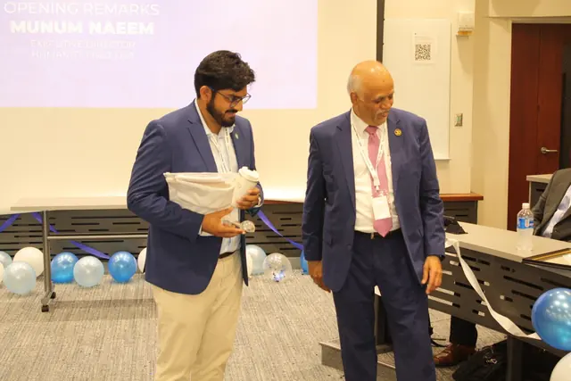 A chapter leader receives an award certificate at the Summit